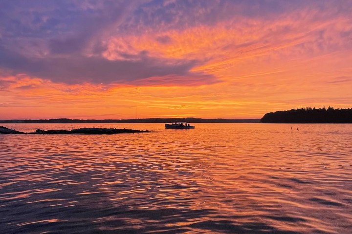 a sunset over a body of water
