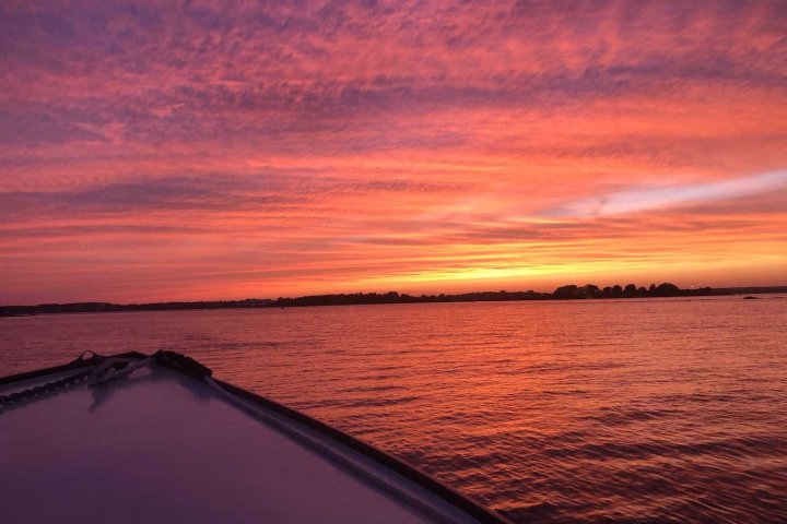 a sunset over a body of water