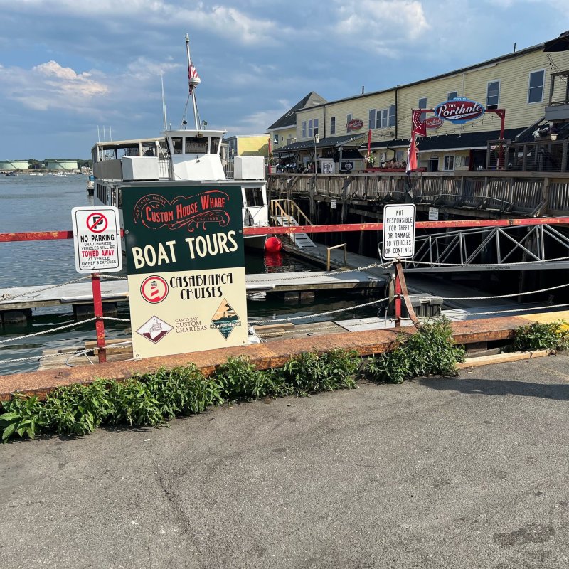 a group of people standing in front of a bridge