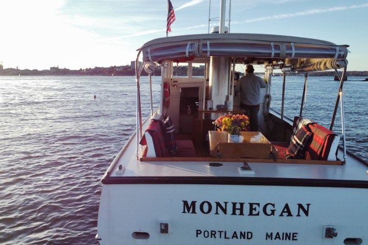 Mohegan from the back perspective, people sitting in cabin of a boat