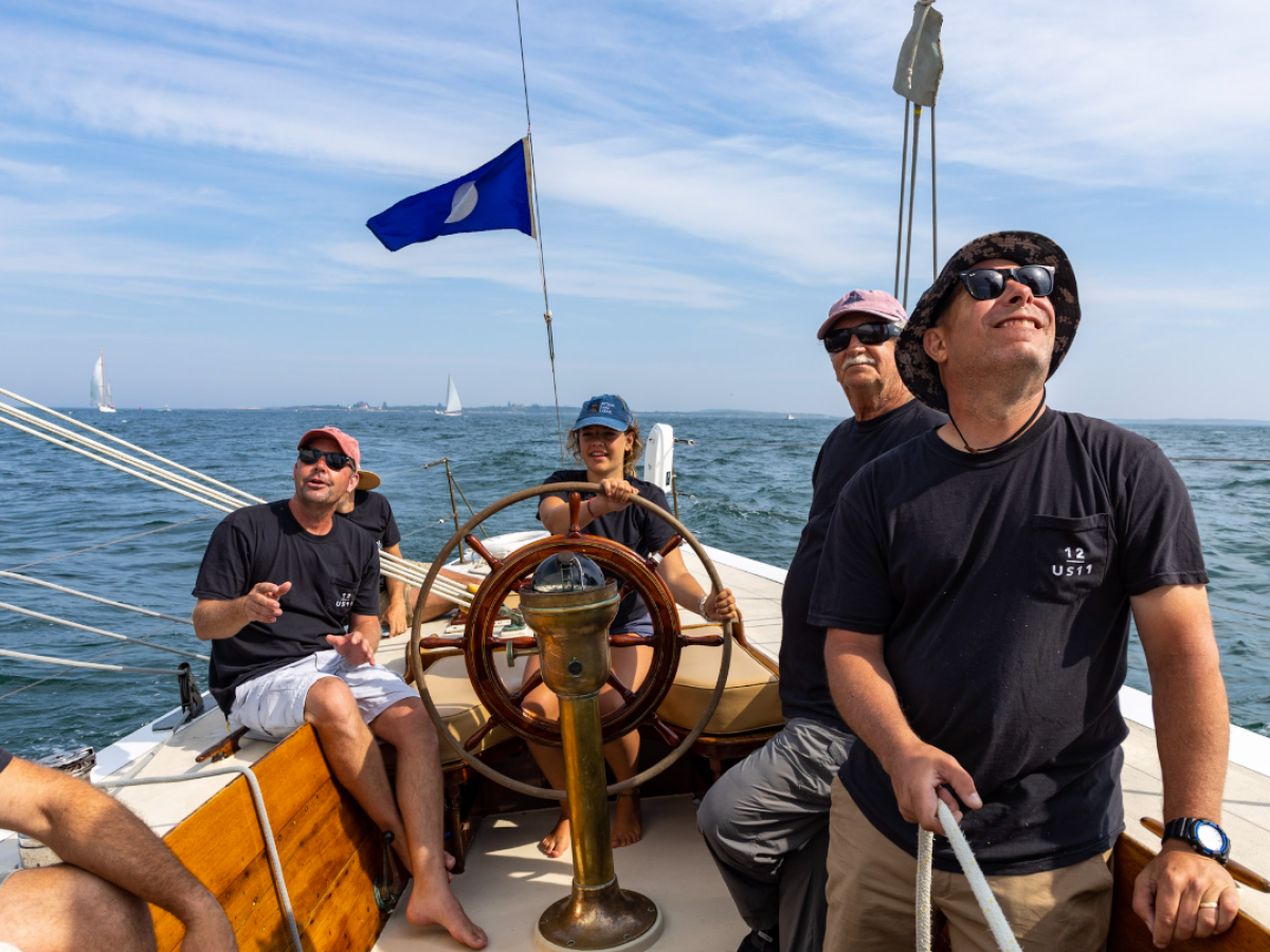 a man sitting in a boat on a body of water