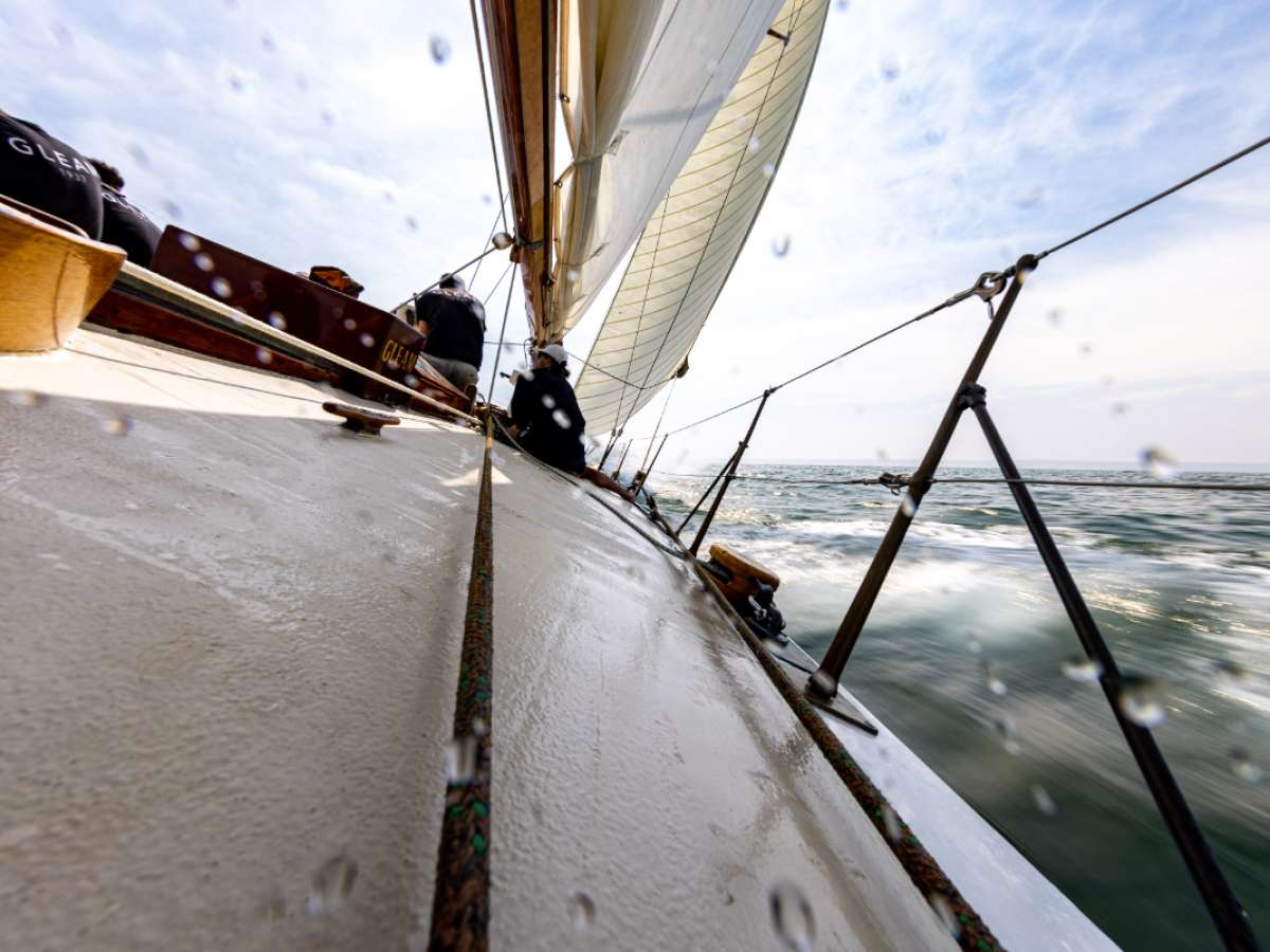 a boat sitting on top of a wooden pole