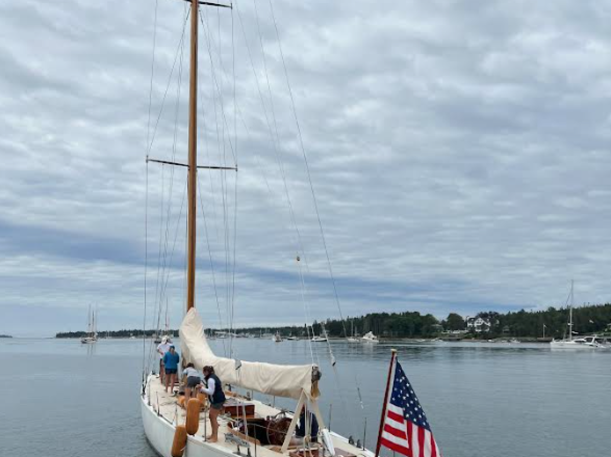 a boat is docked next to a body of water