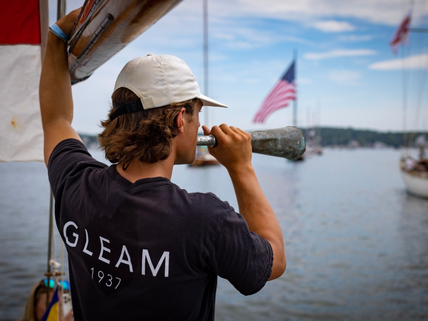 a man standing in front of a body of water