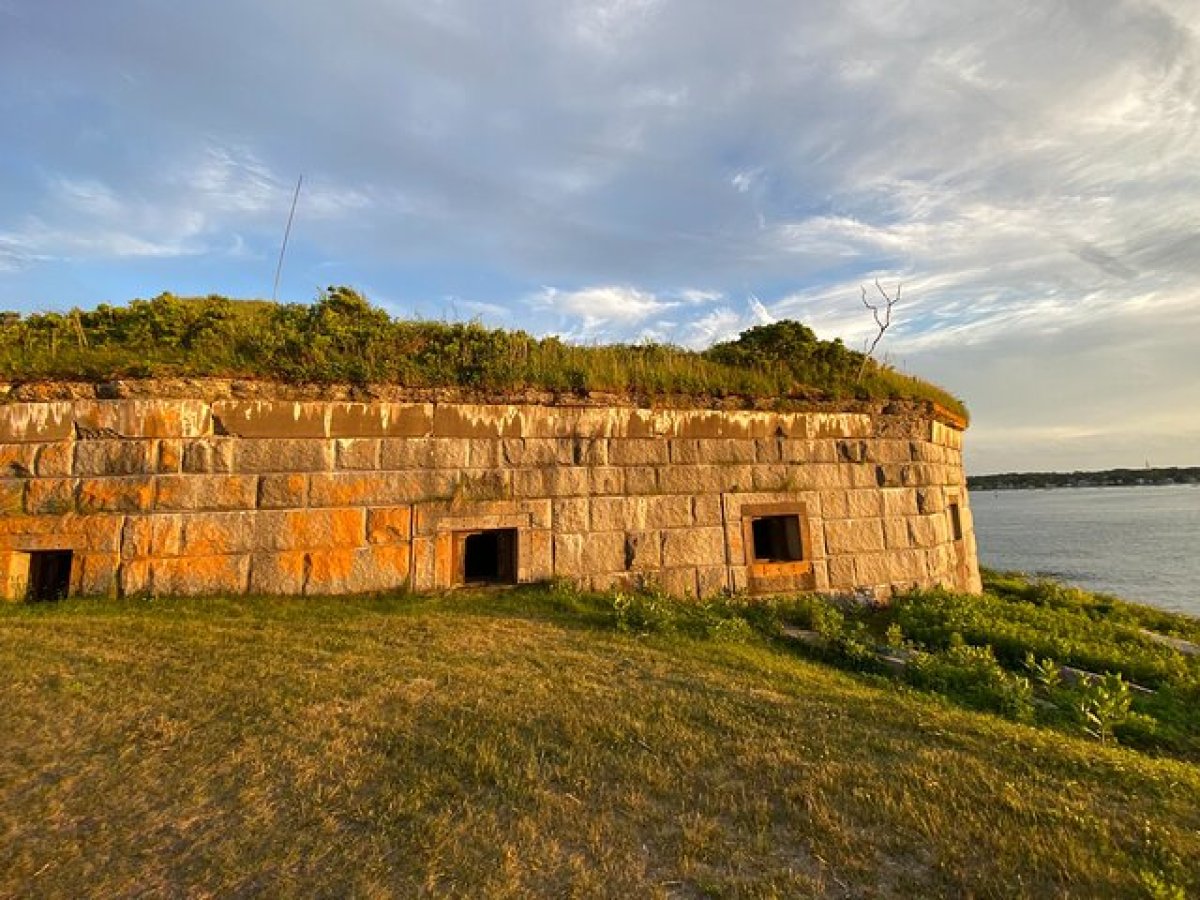 a castle on top of a grass covered field