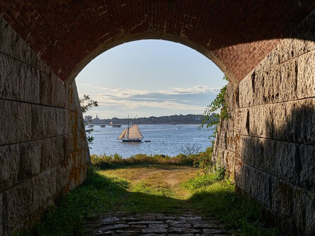 a stone bridge over a body of water