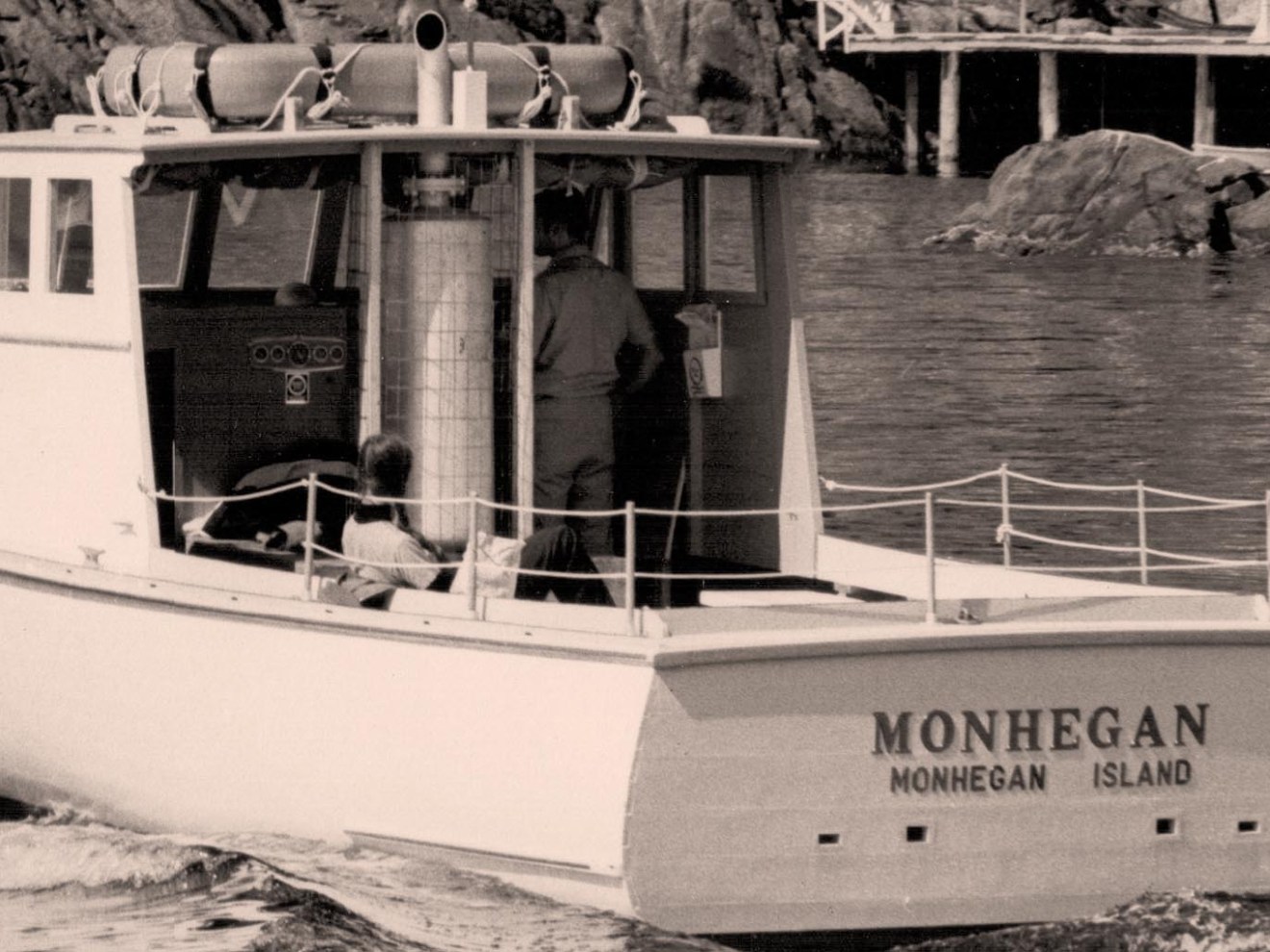 a boat is docked next to a body of water